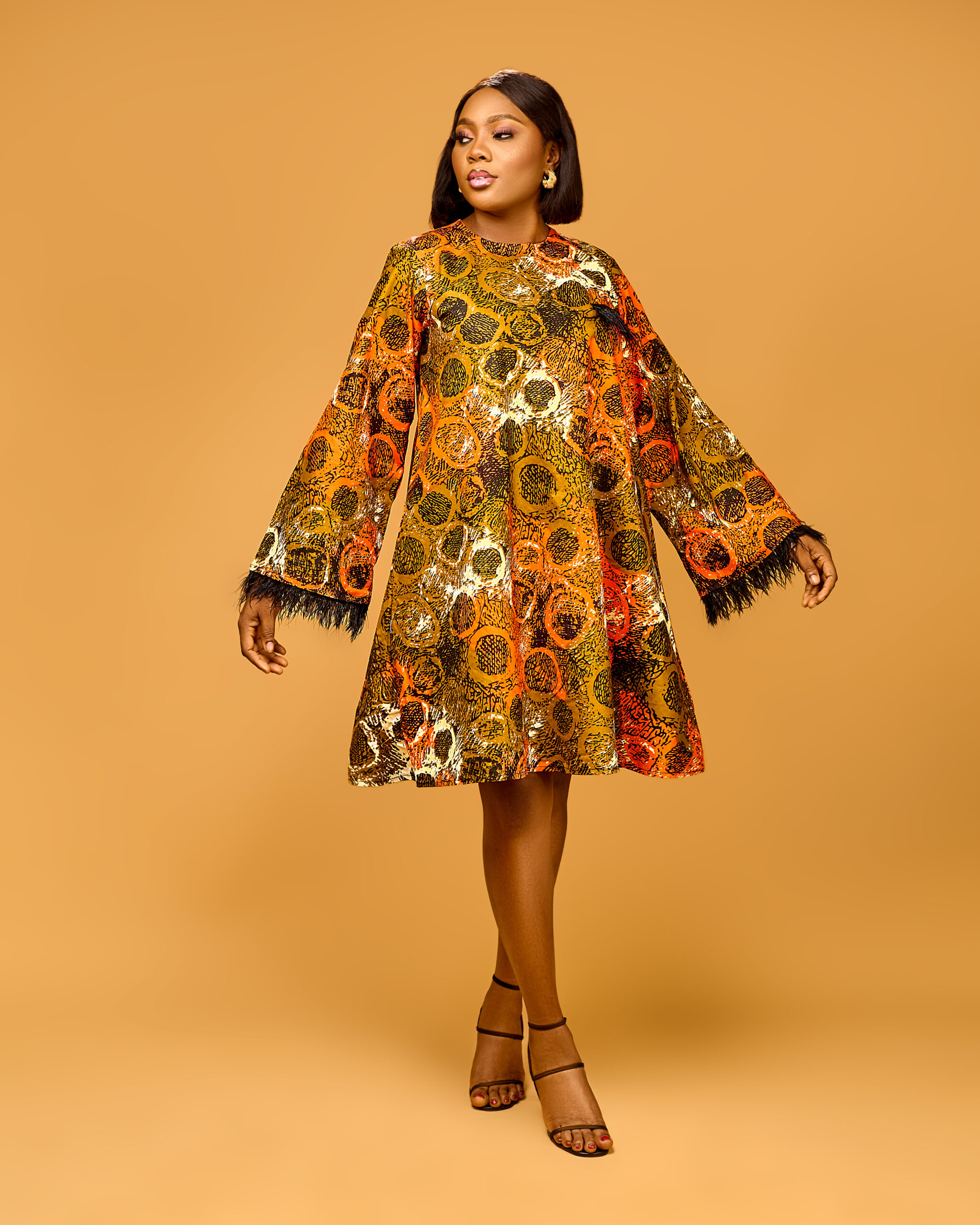 Bronze Circular Print Swing Dress with Feather Trim