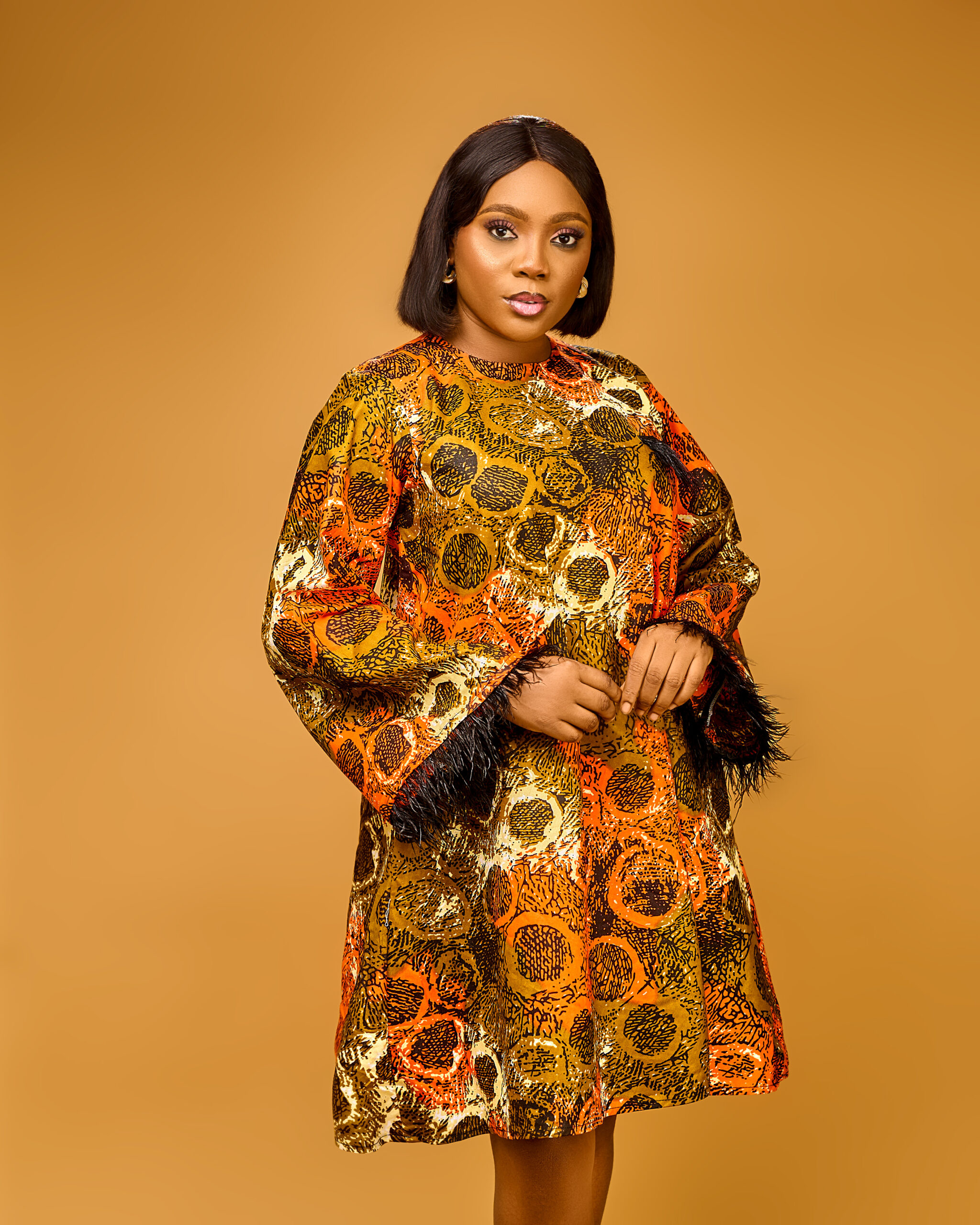 Bronze Circular Print Swing Dress with Feather Trim